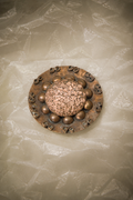 BRONZE Jean AUGIS Broche art déco en bronze émaillé comme des perles